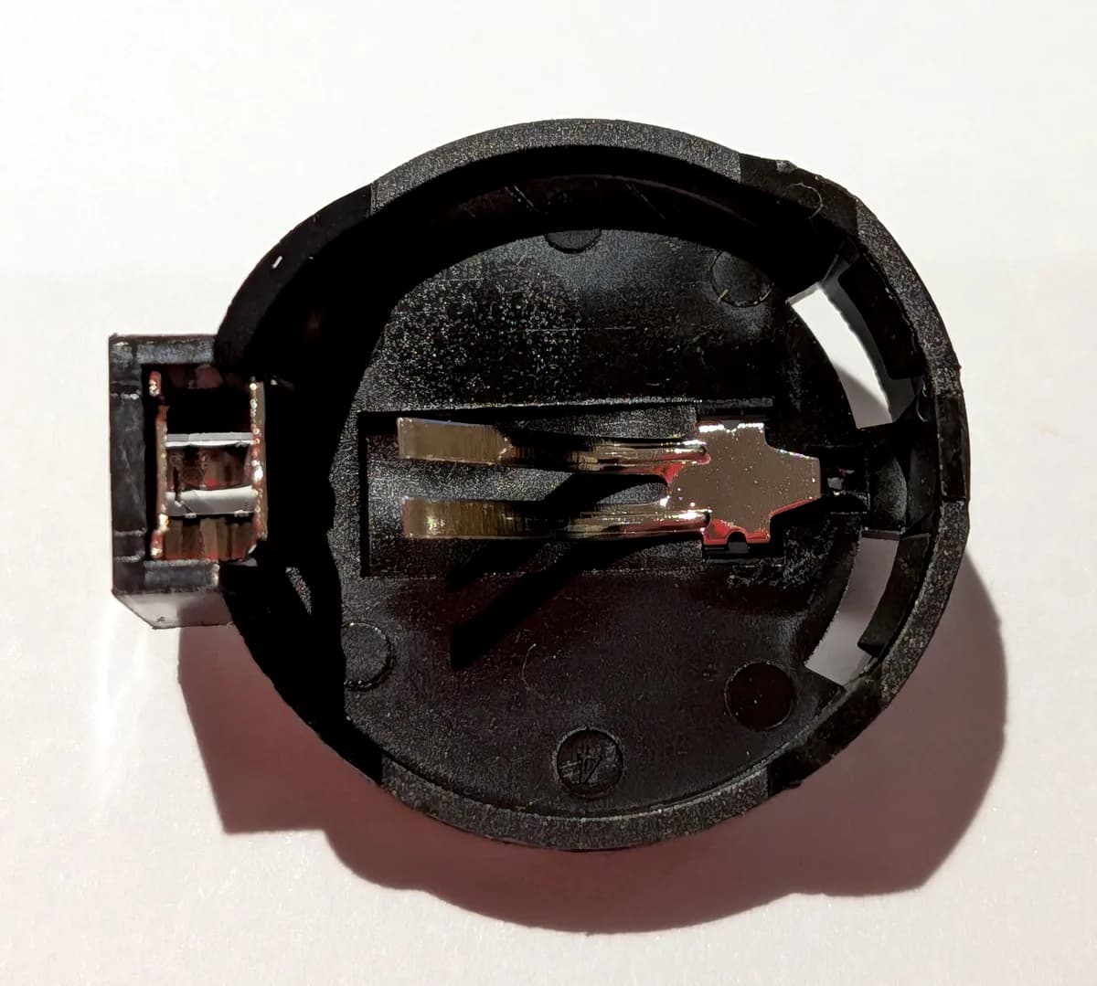 Battery holder, top side