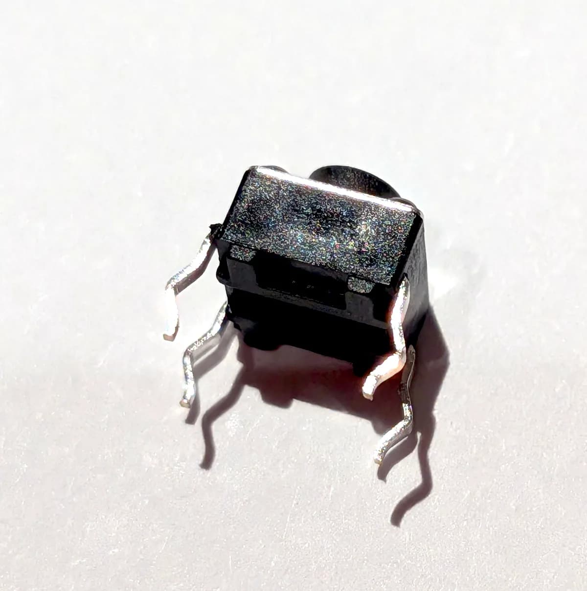 Tactile switch button, bottom side with four leads