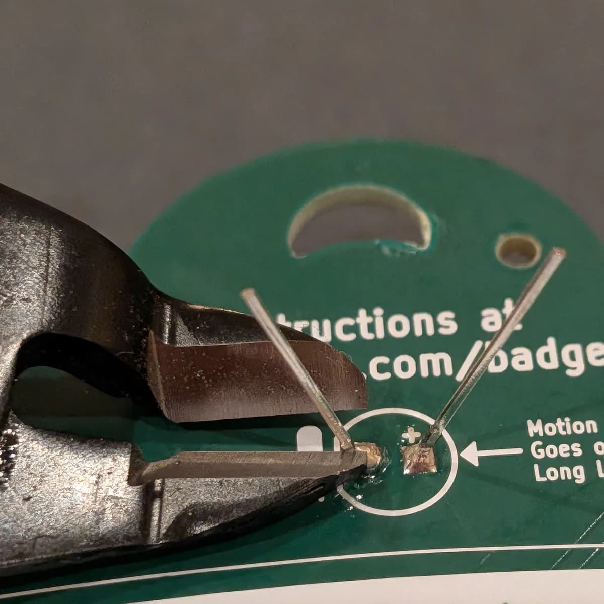 Trimming the excess LED leads with flush cutters